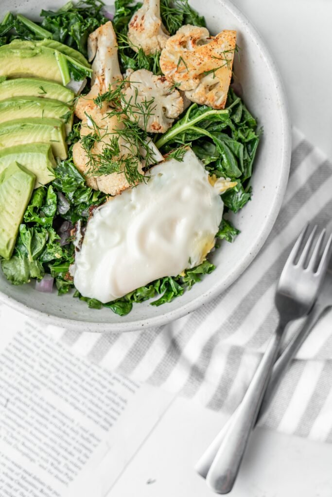 A keto-friendly meal with green vegetables, cabbage and egg-white