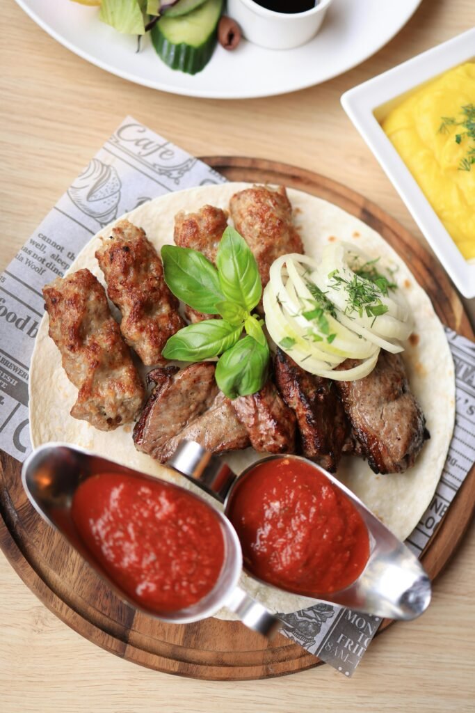 PCOS-friendly meal prep featuring salmon, eggs, avocado, and leafy greens, part of a sugar-free and dairy-free anti-inflammatory diet."